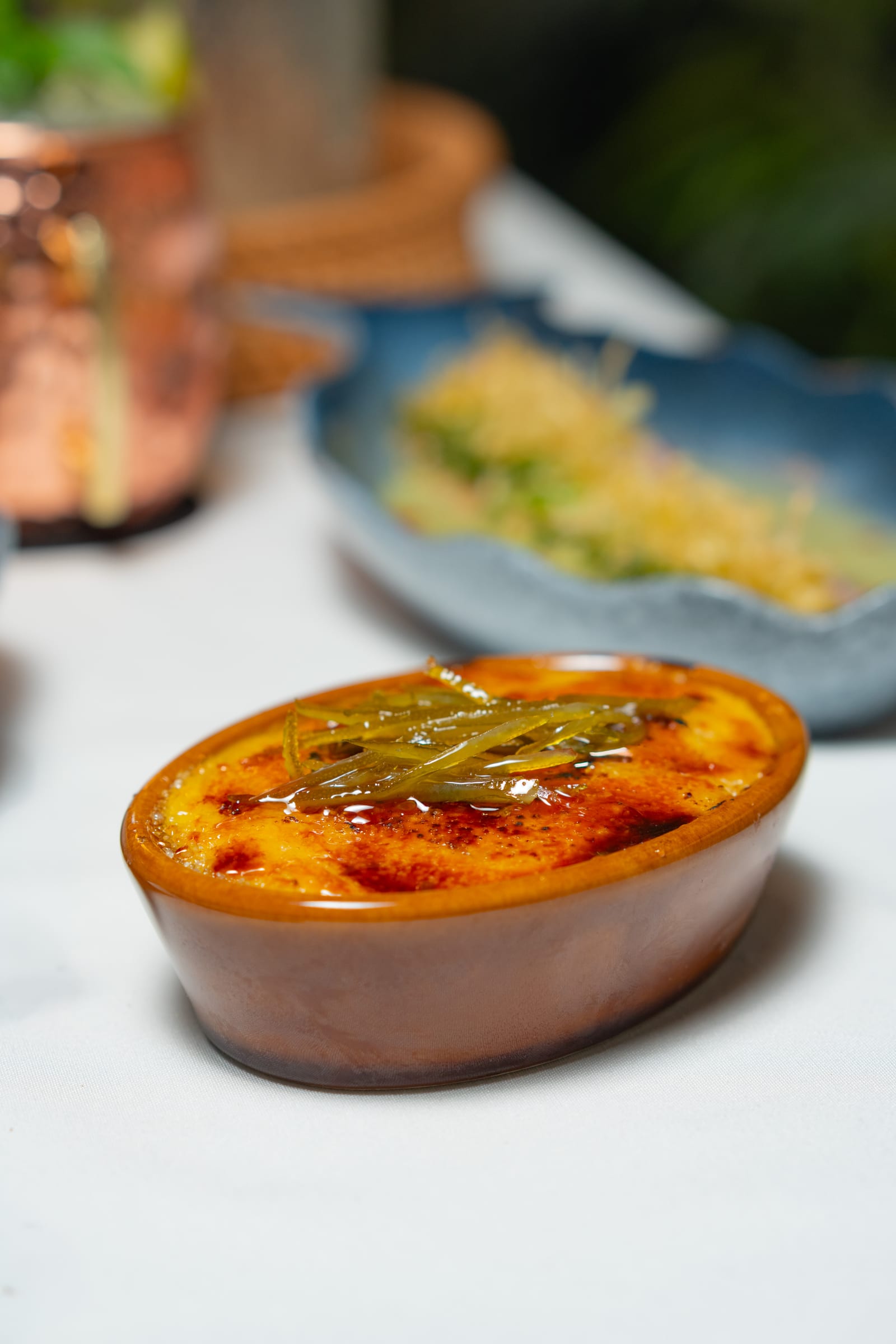 Crème brûlée with caramel crust and candied citrus, the dessert for a proposal dinner at MERO 18 in downtown Cancún