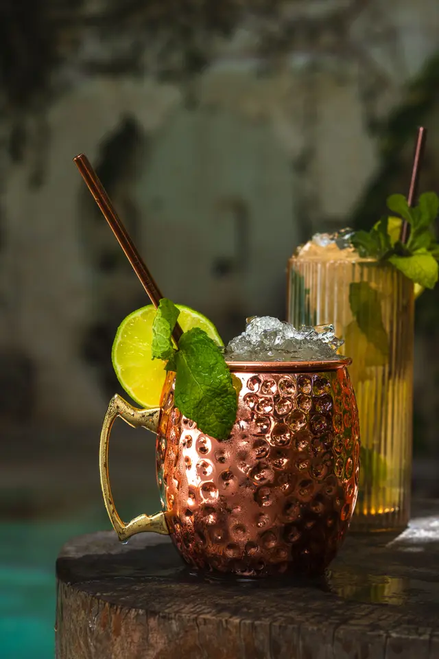 Moscow mule in a hammered copper mug with mint, lime and crushed ice