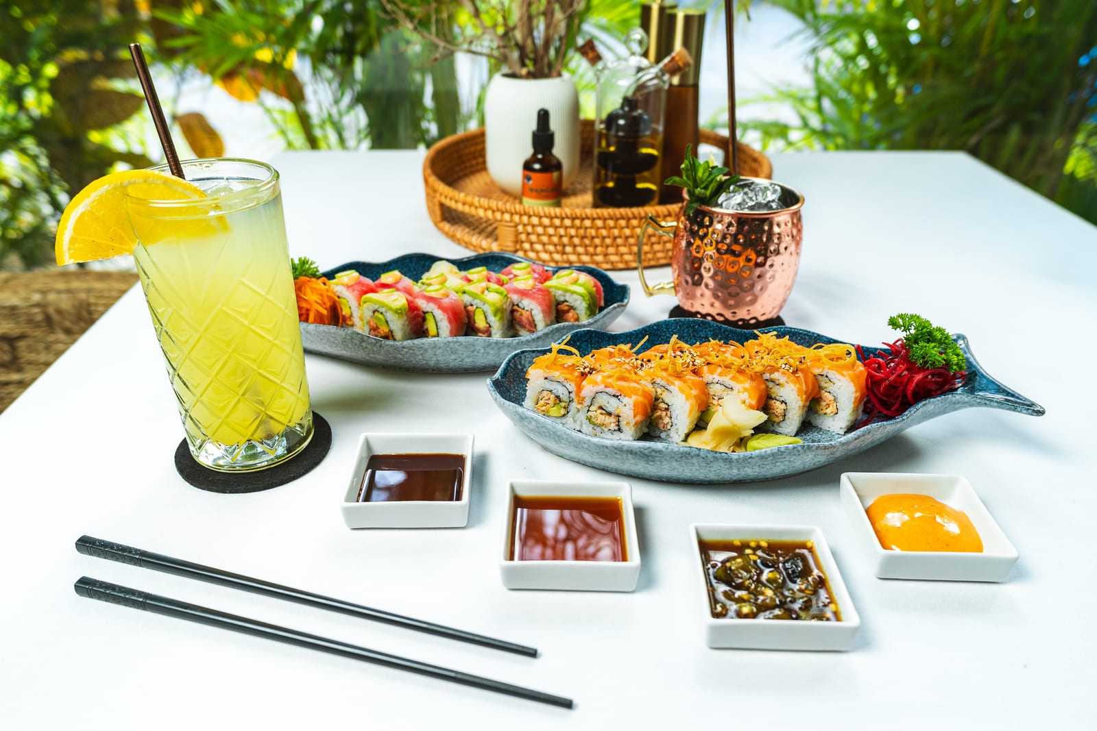MERO 18 table spread with signature sushi rolls, tuna tostada and craft cocktails