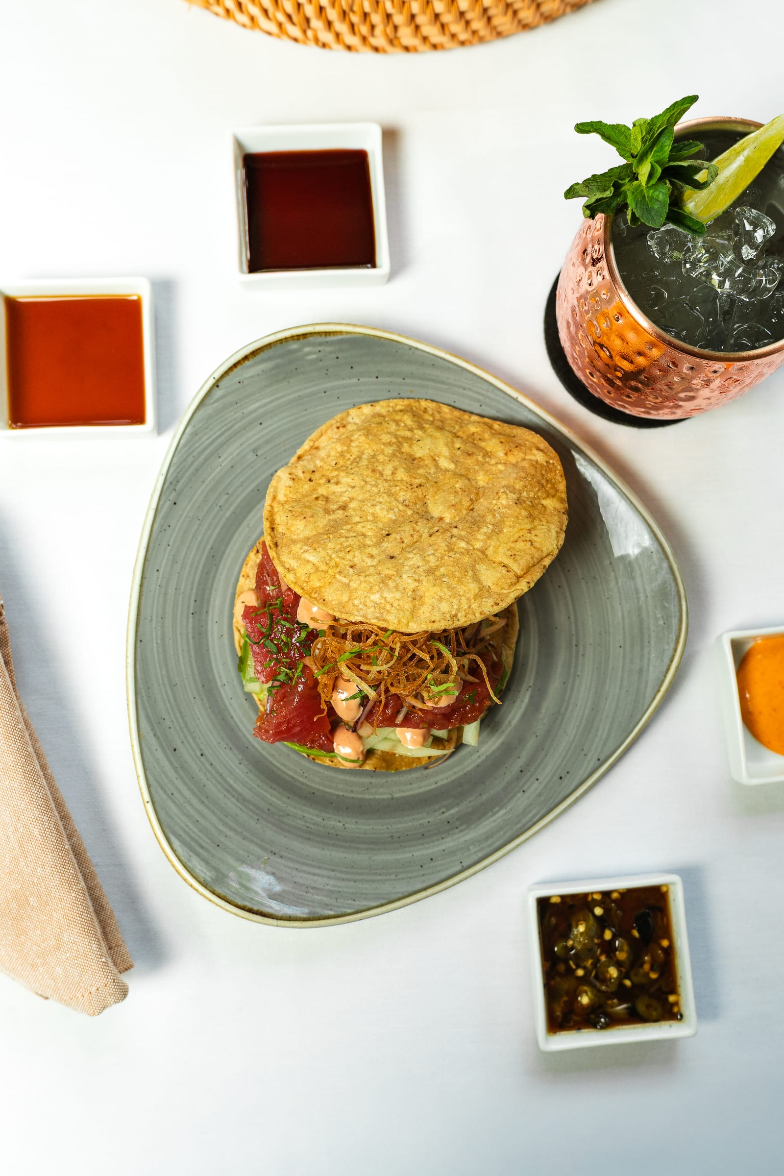 Fresh tuna tostada with avocado and crispy leek from above
