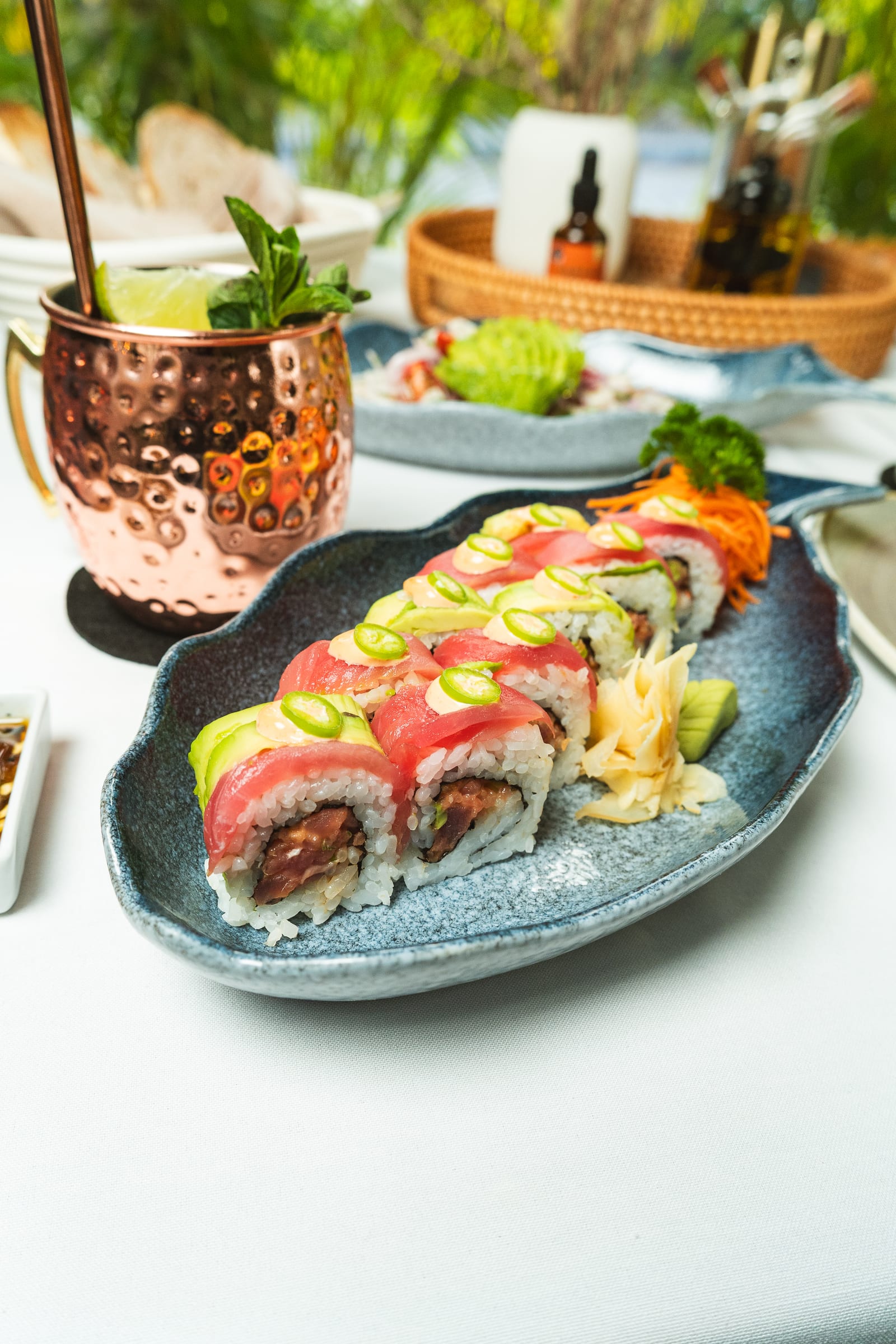 Dos Atunes roll with fresh tuna, avocado and jalapeño on a blue plate